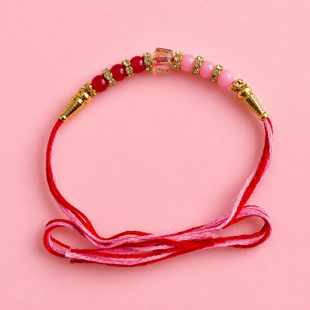 Rakhi With Pink And Red Stones