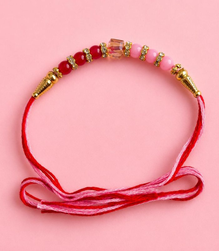 Rakhi With Pink And Red Stones